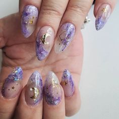 Galaxy nails, galaxy nail designs, and galaxy nail art for a gorgeous manicure Cute Acrylic Nails Sparkle, Galaxy Inspired Nails, Summer Witch Nails, Celestial Nail Art Starry Nights, Galaxy Nails Acrylic, Purple Witchy Nails, Witchy Nail Designs, Purple Sparkle Nails, Galaxy Nail Designs