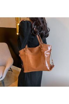 This PU Leather Tote Bag is the perfect accessory for any woman. Its sleek design and durable material make it a versatile and practical choice for everyday use. Crafted with high quality PU leather, this bag combines style and functionality. Expertly designed for a comfortable and stylish experience. Bag size: Large Material: PU leather Imported Product measurements:13*5*8 in Brown Faux Leather Shoulder Bag For Office, Classic Faux Leather Shoulder Bag For Daily Use, Business Faux Leather Handheld Shoulder Bag, Handheld Faux Leather Business Shoulder Bag, Business Handheld Faux Leather Shoulder Bag, Versatile Faux Leather Office Satchel, Soft Faux Leather Office Bag, Office Bags With Leather Handles And Faux Leather, Versatile Faux Leather Satchel For Daily Use