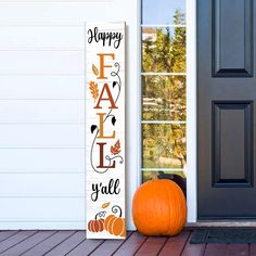 a wooden sign that says happy fall y'all next to a door with a pumpkin