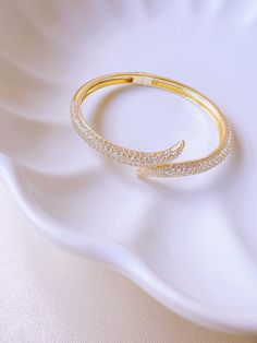 This stunning cuff bracelet is THE statement piece you need for a glam look! This gorgeous bracelet is modern yet elegant. Perfect for a date night or a glam event! It's also a great gift for the Holidays, a birthday, a bridal shower, graduation... DETAILS: - 18K Gold plated - Cubic Zirconia - Spring opening Our jewelry pieces come in a beautiful sheer organza bag. Gold Cuff Bracelet, Womens Cuff Bracelets, Wife Christmas, Bracelet Christmas, Christmas Gifts For Wife, Christmas Gift For Mom, Gold Bracelet For Women, Gold Bracelet Cuff, Gold Cuffs