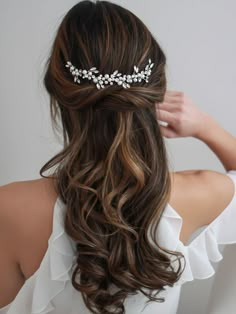 the back of a woman's head wearing a bridal hair comb