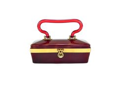 "This beautiful 50s Bakelite and Lucite burgundy purse is in excellent vintage condition. NO cracks, chips or large scratches. The curved Lucite handle is in excellent condition with NO damage at all. All brass hardware is intact with NO missing parts. There is some wear consistent with age and usage. There are couple small scratches on the back of the purse. The inside of the purse has NO cracks or damage. There is a mirror on the top half that has some silver missing but it is still clear and Retro Burgundy Rectangular Bag, Retro Burgundy Formal Bag, Retro Burgundy Formal Bags, Formal Retro Burgundy Bag, Vintage Burgundy Formal Bag, Vintage Red Bags For Formal Occasions, Vintage Red Bag For Formal Occasions, Vintage Red Formal Bag, Vintage Red Formal Bags