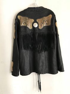 "Chic jacket made of genuine black leather western style, embroidery, fringe, beads, men's size medium. A vintage leather jacket of black color has many original details. This is a real work of art for a fashionable dude; Back and sleeves are decorated with python leather insets; the back is decorated with a long fringe; in the front of jacket are 2 pattern-embroidery by beads in the style of indians original leather pigtails adorn the entire jacket. The original fastening-lacing from a leather Fall Festival Long Sleeve Leather Jacket, Long Sleeve Leather Jacket For Fall Festivals, Black Leather Jacket With Long Sleeves For Festivals, Black Long Sleeve Leather Jacket For Festival, Fall Festival Leather Jacket With Fringe, Winter Festival Outerwear With Beaded Fringe, Winter Festival Leather Jacket With Fringe, Winter Festival Long Sleeve Leather Jacket, Black Western Leather Jacket