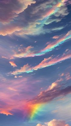 the sky is filled with colorful clouds and a rainbow