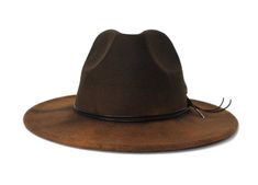 The Thiago hat form the Cartagena CollectionType: Center Dent Wide Brim FedoraSpecifications: Adjustable Size- With a tie of a knot, adjust the fit of your hat to the ideal size from 21 ¼ to 23 ¼ inches.Dimensions: Wired Brim: 2 7/8", Crown: 4"Color: Distressed Brown, Sun bleached for 32 hrs.Materials: 65% Cotton, 35% Polyester Black- Genuine Leather Cord Natural Ringneck Pheasant Feather Green Jasper StoneOrigin: All of our hats begin in Ecuador as the body is molded, then completed in Tucson, Ringneck Pheasant, Hat Form, Brown Fedora, Pheasant Feather, Womens Fedora, Wide Brim Fedora, Green Jasper, Gifts For My Boyfriend, Hippie Outfits