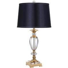 a table lamp with a black shade on the base and a gold plated base