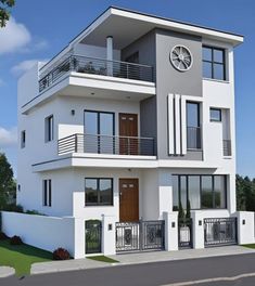 a white two story house with a large clock on the top of it's balcony