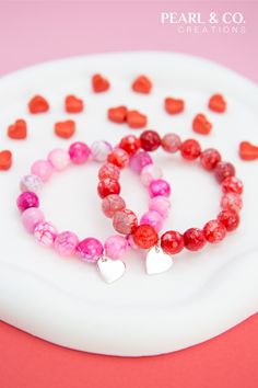 This handmade gemstone bracelet is made of 10mm Agate beads and 11.5mm by 11.8mm 925 Sterling Silver heart charm which are strung on a high quality stretch cord. This beaded stretch bracelet comes in 2 different colours: red and pink. This gemstone bracelet is a beautiful gift idea for a Birthday, Anniversary, Mother's Day, Valentine's Day or as a present without an occasion for yourself or someone you care about. Pink Bracelet, Beaded Stretch Bracelet, Silver Heart