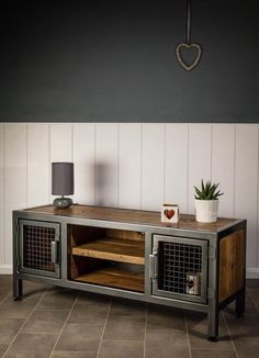 an entertainment center with metal and wood accents