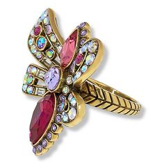 Heidi Daus "Summer Bug" Crystal Ring Get ready for fun, summertime fashion with the "Summer Bug" crystal ring from Heidi Daus. The crystal-studded piece features your choice of predominately blue or pink crystals in a whimsical, sparkling design.       Approx. 1-1/2"L x 1-3/4"W x 3//8"H; shank 1/8"W     Center drop approx. 1-5/8"L x 1-3/4"W     Bronzetone; oxidized, textured finish     Ring shaped like a moth or butterfly adorned with colored crystals in choice of Blue Multi or Red Multi     Rop Adjustable Rings For Spring Party, Spring Party Rings Adjustable, Adjustable Spring Party Rings, Summer Crystal Jewelry As A Gift, Adjustable Crystal Jewelry For Summer, Big Statement Rings, Heidi Daus, Zircon Jewelry, Ring Shapes