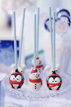 there are some cake pops decorated like snowmen