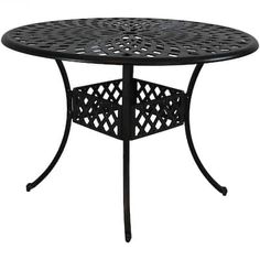 an outdoor table that is black and has holes in the top, on a white background