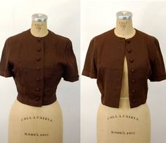 "This 1940s jacket is a great piece for your collection.  It's a versatile jacket that's lightweight but a rich brown color so could be worn in several seasons. It's flattering, with seaming that complements the figure.  There are covered buttons down the front and a cute pointed accent on the back waist. The sleeves have rolled up cuffs. Very nicely made. No labels present. Excellent condition. Measurements -  Shoulder - 15 1/2\" Bust - 36\" Waist - 28\" Length - 19\" * Proud member of the Vint Fitted Brown Cropped Jacket For Work, Fitted Cropped Brown Outerwear, Vintage Cropped Fitted Outerwear, Fitted Vintage Cropped Jacket, Fitted Vintage Cropped Jacket For Work, Vintage Cropped Outerwear For Work, Embroidered Robes, Vintage Runway