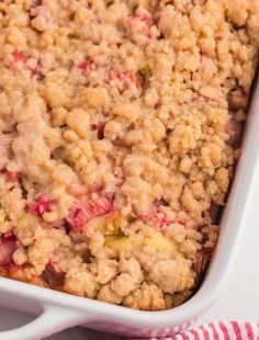 rhubarb coffee cake in a white casserole dish with text overlay