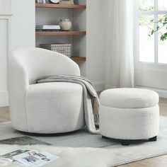 a white chair and ottoman in a room