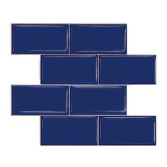 blue glass subway tile in an angled pattern