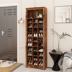 a wooden shoe rack in the corner of a room