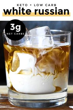 a glass filled with ice and white russian