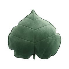 a green leaf shaped pillow on a white background