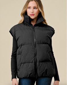 Nylon windbreaker puffer high-collar vest with pockets. 100% Nylon. Lining:100% Polyester Model is 5'8" and is wearing a small. Vest With Pockets, Collar Vest, Puffer Vest, High Collar, Puffer, Collar, How To Wear