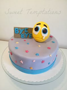 a birthday cake with a smiley face on top