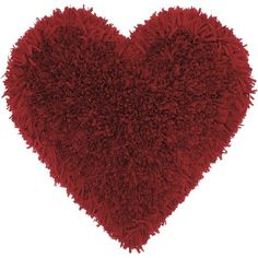 a red heart shaped pillow on a white background