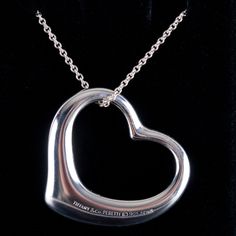 Tiffany & Co. Elsa Peretti Sterling Silver Open Heart Necklace W/ Pouch 18gMetal Information: .925 Sterling SilverTotal Weight: 18gChain Width: 1.5mmChain Length: 30"Pendant Dimensions: 35mm x 35mmBrand: Tiffany & Co.Designer: Elsa PerettiAdditional Information: Includes Tiffany & Co. PouchEstimated Retail Price: $1560.00OUR PRICE: $1250.0045817 Elegant Heart Pendant Necklace With Hallmarks, Elegant Sterling Silver Hallmarked Heart Necklace, Luxury Silver Heart Necklace Gift, Silver Jewelry For Evening Valentine's Day, Valentine's Day Silver Jewelry For Evening, Valentine's Day Evening Silver Jewelry, Luxury Sterling Silver Heart Necklace For Formal Occasions, Classic Polished Heart Necklace For Wedding, Luxury Silver Heart Necklace For Formal Occasions