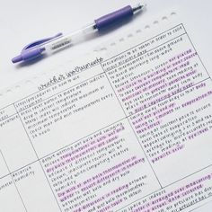 a notepad with some writing on it and a pen next to it that has been written in purple ink