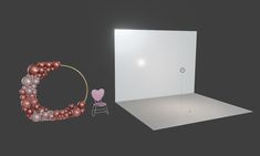 an empty photo studio with balloons and a chair