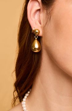 Light up everyday ensembles with these swinging drop earrings that beam with a high-polish finish. 1 1/2" drop Goldtone plate Imported Classic Teardrop Metal Clip-on Earrings, Formal Drop Metal Earrings, Metal Drop Earrings With Polished Finish, Polished Metal Drop Earrings, Metal Drop Jewelry With Shiny Finish, Classic Drop Metal Jewelry, Classic Metal Drop Jewelry, Classic Drop Shape Metal Jewelry, Metal Long Drop Teardrop Earrings For Formal Occasions