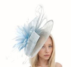 Hats By Cressida Kentucky Derby & Ascot Fascinator Hats Baby Blue Adonis Sinamay & Feather Disc Fascinator Hat Baby blue sinamay swirls trimmed with a mass of baby blue feathers and curled burnt feathers on a large sinamay base The hat base measures about 12 inches wide This baby blue fascinator is mounted with matching headband If you prefer a headband to match your hair, please make a note at check out what colour headband you want. This formal occasion fascinator is perfect for any special event such as a wedding, bridal shower, tea party or ladies luncheon.  This headpiece also is great for a day at the races like the Kentucky Derby, Ladies Day, Royal Ascot, Cheltenham, Goodwood, Dubai Cup, Breeders Bup and Spring Racing Festival.  We make each hat to order just for you, we would prefe Light Blue Headpiece For Royal Ascot Party, Light Blue Headpiece For Kentucky Derby Party, Light Blue Mini Hat For Kentucky Derby Party, Blue Spring Headpieces For Events, Blue Headpieces For Spring Events, Elegant Light Blue Headpiece For Party, Light Blue Fitted Fascinator For Kentucky Derby, Fitted Light Blue Fascinator For Kentucky Derby, Elegant Light Blue Fascinator For Party