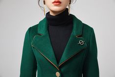 "This stunning dark green wool coat for womens is beautifully fitted and tailored for a classic, feminine design. There is a brooch decoration on lapels.The long wool coat features dark green, a slim fitting bodice with long sleeves and fitted waist leading into a long,flowing skirt coat. Details : * dark green wool blend fabric with polyester lining * two pockets * button closure in front * lapel collar * long sleeves * brooch decoration * winter coat, spring coat, womens coat * mid calf length Elegant Wool Coat With Suit Collar For Office, Elegant Green Wool Coat, Elegant Green Blazer For Fall, Elegant Tailored Dark Green Blazer, Elegant Green Wool Outerwear, Elegant Green Wool Coat For Fall, Elegant Green Long Wool Coat, Elegant Green Blazer With Lapel Collar, Elegant Green Blazer With Button Closure