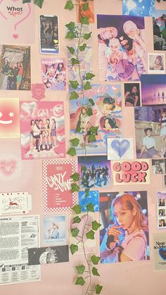 a wall covered in photos and pictures with a plant growing out of the bottom right corner