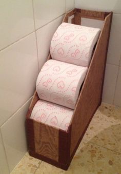 a magazine holder is used to store a good amount of space for toilet paper rolls