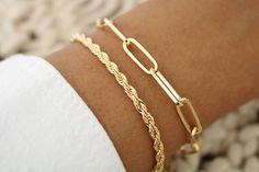 This 3 mm Gold Rope Bracelet is expertly crafted and diamond cut to catch the light at every angle.  A beautiful and affordable alternative to solid gold. 18k Gold filled laminate is an excellent option for long-lasting pieces. High quality guaranteed (NO TARNISH) Please note: this listing is for one bracelet only   18K GOLD-FILLED?   18k gold-filled jewelry is created with a thick layer of 18k solid gold over a metal core. Gold-filled jewelry is a beautiful, and affordable alternative to solid Dainty Gold Bracelet With Diamond Cut For Everyday, Dainty Gold Bracelets With Diamond Cut, Everyday Diamond Cut Chain Bracelet, Dainty Everyday Diamond Cut Bracelets, Adjustable Gold Chain Bracelet With Diamond Cut, Adjustable Gold Diamond Cut Chain Bracelet, Gold Rope Bracelet, Black Tourmaline Necklace, Dainty Gold Bracelet