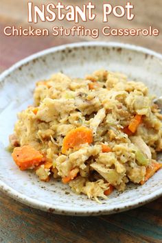 chicken stuffing casserole with carrots and celery in a white bowl