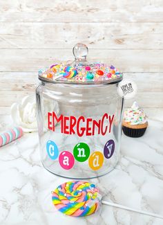 an emergency candy jar with cupcakes and candies