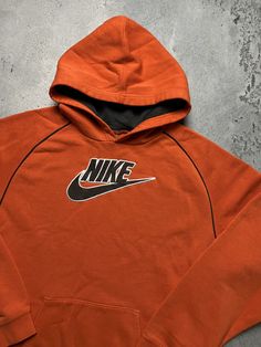 Hoodie Nike Vintage center logo swoosh hype fit Travis Style Size Men's / US M / EU 48-50 / 2 Color Orange Condition Gently Used Nike Vintage central logo central swoosh crewneck 80s 90s 00s retro spellout y2k sweatshirt centre swoosh big logo.   The material is pleasant to the body. In a good condition. Fast sending! Tag size XL, but fits size M. (See measurements) Condition : 9/10 Chest - 54 cm Length - 63 cm Sleeve length from neck - 71 cm Sleeve length from armpit - 49 cm - ALL ITEMS ARE HEA Winter Athleisure Hoodie With Logo Detail, Winter Athleisure Hoodie With Logo, Logo Cotton Hoodie In Athleisure Style, Sporty Long Sleeve Hoodie With Logo, Sports Long Sleeve Hoodie With Logo, Logo Hoodie Sweatshirt In Athleisure Style, Sporty Logo Hoodie For Winter, Sportswear Fleece Hoodie With Logo Print, Logo Athleisure Hoodie