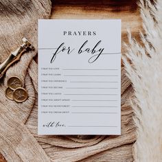 a card that says, prayer for baby on it next to a pair of scissors