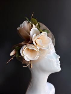 Simply stunning fascinator that encapsulates the beauty of a freshly bloomed magnolia flower. Crafted with intricate precision, the lifelike petals and delicate details are a testament to its elegance. Its natural charm and beauty will have you looking like a true Southern belle, perfect for tea parties and Kentucky derby. Age Group/Gender - Adult/Women Size/Type - One size fits all adults Elegant Flower Headpieces For Spring, Elegant Flower Hair Accessories For Spring, Elegant Spring Flower Hair Accessories, Elegant Headpiece With Handmade Flowers, Elegant Headpieces With Handmade Flowers As Gift, Cream Flower Headpiece With Handmade Flowers, Elegant Flower Headpieces For Gifts, Elegant Flower-shaped Hair Accessories With Handmade Flowers, Elegant Flower Hair Accessories For Kentucky Derby