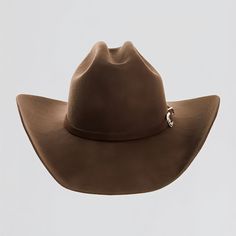 Introducing the Cattleman - Brown Felt Cowboy Hat! This shows off a handsome cowboy brown band that is perfect for those seeking a rustic look. The brim measures 3 3/4", while the crown comes in at 4 1/2". The hatband is sewn in and the hat is made of wool felt.