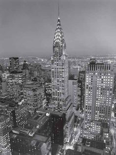 a black and white photo of the chrysler building in new york city, ny at night