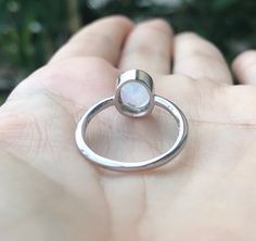 "A stackable sterling silver ring featuring a faceted oval-shaped Rainbow Moonstone set in a simple bezel setting, which makes a great birthstone ring for those June Birthdays. Wrapped in a box ready for gift giving.(r-new-29) Rainbow Moonstone measure 8mm x 6mm *Follow us @belesasjewelry on Instagram for promotions/giveaways *LIKE* us on Facebook http://www.facebook.com/Belesas to find special coupon codes *If you like the ring, please click on the \"Pin It\" icon ------------------------------ Oval Opal Stackable Rings, Adjustable Oval Moonstone Ring With Bezel Setting, Stackable Rings With Moonstone Gemstones, Oval Moonstone Gemstone Stackable Rings, Oval Moonstone Stackable Rings With Gemstone, Minimalist Oval Moonstone Ring With Bezel Setting, Oval Sterling Silver Stackable Moonstone Ring, Silver Oval Moonstone Ring With Bezel Setting, Oval Moonstone Stackable Ring In Sterling Silver