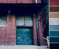 an old brick building with green doors and brown shutters on the outside, along with several different color swatches