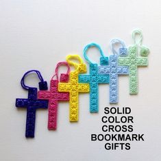 four crocheted cross bookmarks with the words sold