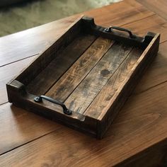 a wooden tray sitting on top of a table