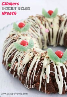 a chocolate cake with white icing and sprinkles on a glass plate