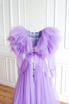 Lavender Tulle Maternity Robe for Photoshoot, Tiered Photoshoot Robe, Sheer Pregnancy Robe, Robe for Photoshoot, Boudoir Robe Dress Tulle robe with tulle ruffles can be used for the boudoir photoshoots not only maternity, but non-maternity. Sleeves are decorated with pearl buttons Robe can be used for maternity or non maternity pictures for XS -XL sizes After payment is received gown will be ready to ship in 5-7 business days. I provide worldwide shipping. All items are shipped with registered m Lavender Ruffled Wedding Gown, Purple Fairy Dress With Ruffles For Weddings, Tulle Wedding Night Dress With Ruffles, Widow Robe, Maternity Photo Dress, Maternity Gowns For Photoshoot, Ruffle Tulle Dress, Tulle Maternity Dress, Blue Maternity Dress