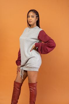 We know you like to stay stylish and comfy...our GABRIELLE sweater dress feels like pajamas but looks incredibly chic. Ready to dress up with an over-the-knee boot or dress down with sneakers. Featuring long ruched sleeves, 2 colour-block hues in burgundy/grey, and tie-up detail on the bottom hem. Materials: 64% Rayon, 32% Polyester, 4% Spandex French Terry Brush Fabric Product Origin: USA Model size: Model is 5’8, wearing size S Care Instructions: Hand Wash/Hang Dry or Dry Clean Casual Fall Sweatshirt Dress With Ribbed Cuffs, Color Block Mini Dress For Fall, Casual Fall Color Block Dresses, Fall Color Block Mini Dress, Trendy Long Sleeve Loungewear Dress, Long Sleeve Dresses With Ribbed Cuffs For Fall, Fall Long Sleeve Dresses With Ribbed Cuffs, Sporty Long Sleeve Sweatshirt Dress For Fall, Long Sleeve Dresses With Drawstring For Fall