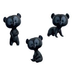 three black teddy bears sitting next to each other